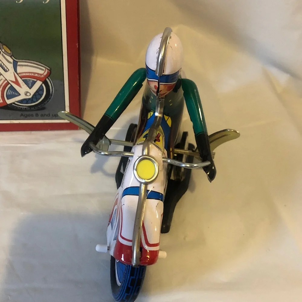 Motorcycle Racer wind up pressed tin new old stock mint condition 7.5” long